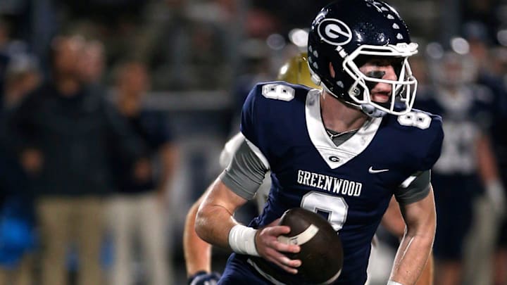 Greenwood's Kane Archer is chased out of the pocket by a Pulaski Academy defender while looking for a receiver during the 5A West Conference game on Oct. 28 at Smith Robinson Stadium. Greenwood's Kane Archer is chased out of the pocket by a Pulaski Academy defender while looking for a receiver during the 5A West Conference game on Oct. 28 at Smith Robinson Stadium.