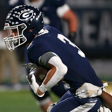 Greenwood's Grant Karnes (3) tries to break free from the tackle of Pulaski Academy's KJ Colen during the 6A West Conference game on Oct. 28 at Smith Robinson Stadium.