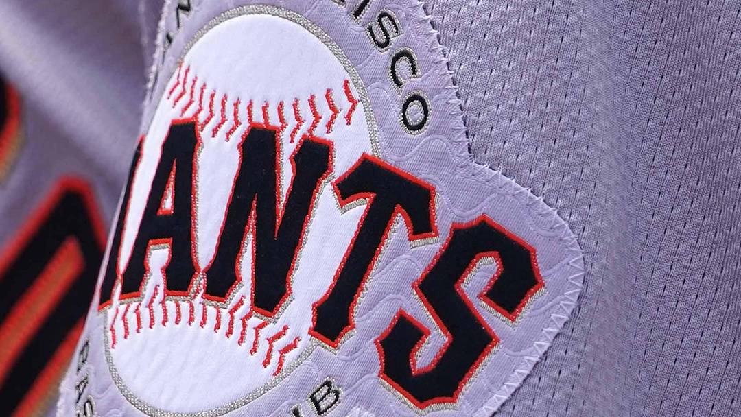 Sep 19, 2024; Baltimore, Maryland, USA; San Francisco Giants team members wear a patch to honor the memory of longtime player Orlando Cepeda during action against the Baltimore Orioles at Oriole Park at Camden Yards.