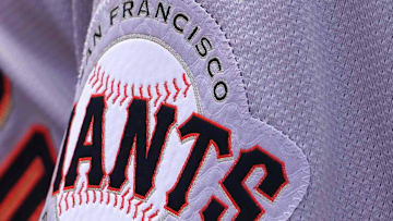 Sep 19, 2024; Baltimore, Maryland, USA; San Francisco Giants team members wear a patch to honor the memory of longtime player Orlando Cepeda during action against the Baltimore Orioles at Oriole Park at Camden Yards.