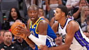 Oct 9, 2024; Sacramento, California, USA; Sacramento Kings forward Keegan Murray (13) defends against Golden State Warriors forward Jonathan Kuminga (00) during the first quarter at Golden 1 Center. Mandatory Credit: Ed Szczepanski-Imagn Images