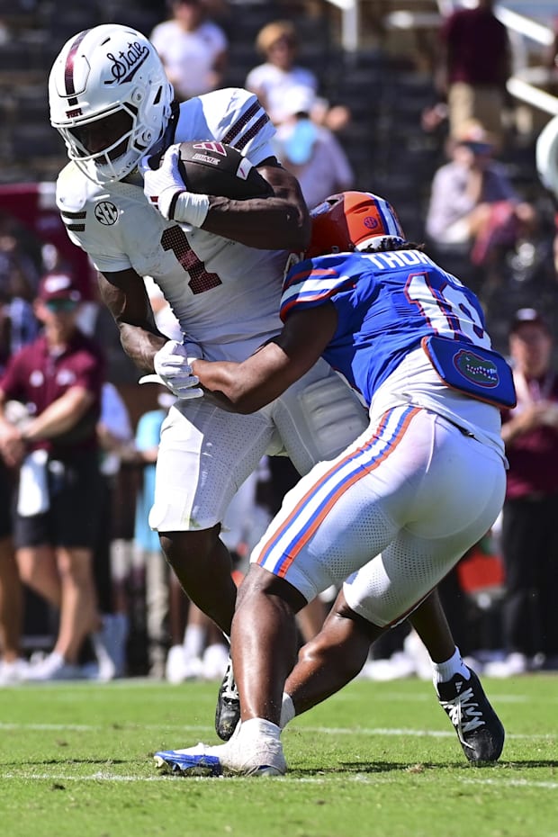 Mississippi State Bulldogs wide receiver Kelly Akharaiyi (1) runs the ball against Florida Gators.