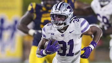 Oct 19, 2024; Morgantown, West Virginia, USA; Kansas State Wildcats running back DJ Giddens (31) runs after a catch during the third quarter against the West Virginia Mountaineers at Mountaineer Field at Milan Puskar Stadium. Mandatory Credit: Ben Queen-Imagn Images