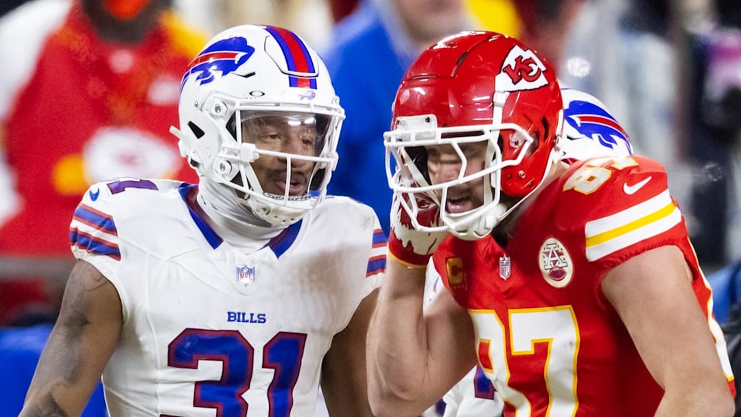 Jan 26, 2025; Kansas City, MO, USA; Kansas City Chiefs tight end Travis Kelce (87) reacts as he talks to Buffalo Bills cornerback Rasul Douglas (31) during the AFC Championship game at GEHA Field at Arrowhead Stadium. Mandatory Credit: Mark J. Rebilas-Imagn Images