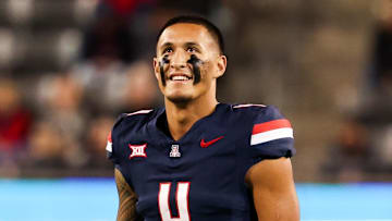 Nov 15, 2024; Tucson, Arizona, USA; Arizona Wildcats wide receiver Tetairoa McMillan (4) smiles at the scoreboard during the first quarter against the Houston Cougars at Arizona Stadium. Mandatory Credit: Aryanna Frank-Imagn Images