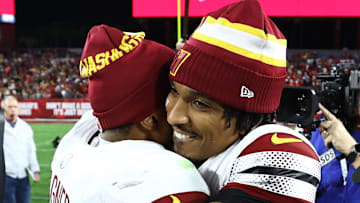 Jan 12, 2025; Tampa, Florida, USA; Washington Commanders quarterback Jayden Daniels (5) celebrates with linebacker Bobby Wagner (54) after winning a NFC wild card playoff against the Tampa Bay Buccaneers at Raymond James Stadium. Mandatory Credit: Kim Klement Neitzel-Imagn Images