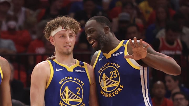 Apr 30, 2025; Houston, Texas, USA; Golden State Warriors forward Draymond Green (23) talks to guard Brandin Podziemski (2) and guard Moses Moody (4) before playing against the Houston Rockets in the second quarter during game five of first round for the 2025 NBA Playoffs at Toyota Center. Mandatory Credit: Thomas Shea-Imagn Images