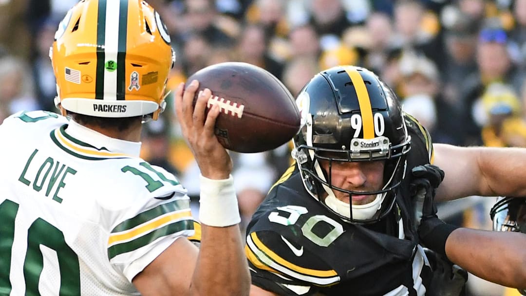 Green Bay Packers quarterback Jordan Love (10)is pressured by Pittsburgh Steelers linebacker T.J. Watt in 2023.