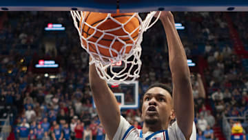 Nov 30, 2024; Lawrence, Kansas, USA; Kansas Jayhawks guard Rylan Griffen (6) dunks the ball during the second half against the Furman Paladins at Allen Fieldhouse. Mandatory Credit: Jay Biggerstaff-Imagn Images
