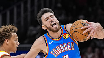 Oct 25, 2025; Atlanta, Georgia, USA; Oklahoma City Thunder center Chet Holmgren (7) is fouled by Atlanta Hawks guard Dyson Daniels (5) during the second half at State Farm Arena. Mandatory Credit: Dale Zanine-Imagn Images