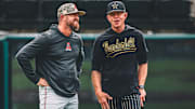 Alabama head coach Rob Vaughn, left, talks with Vanderbilt head coach Tim Corbin before Friday's SEC series opener at Hawkins Field.
