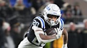 Nov 29, 2025; Durham, North Carolina, USA;  Duke Blue Devils running back Nate Sheppard (20) runs the ball during the fourth quarter against the Wake Forest Demon Deacons at Wallace Wade Stadium. Mandatory Credit: Zachary Taft-Imagn Images