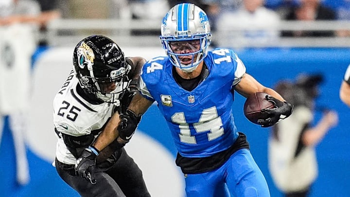 Detroit Lions wide receiver Amon-Ra St. Brown (14) makes a catch against Jacksonville Jaguars cornerback Ronald Darby (25) during the second half at Ford Field in Detroit on Sunday, Nov. 17, 2024. Detroit Lions wide receiver Amon-Ra St. Brown (14) makes a catch against Jacksonville Jaguars cornerback Ronald Darby (25) during the second half at Ford Field in Detroit on Sunday, Nov. 17, 2024.