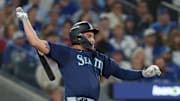 Oct 20, 2025; Toronto, Ontario, CAN; Seattle Mariners first baseman Josh Naylor (12) hits a RBI single in the first inning against the Toronto Blue Jays during game seven of the ALCS round for the 2025 MLB playoffs at Rogers Centre. Mandatory Credit: Nick Turchiaro-Imagn Images