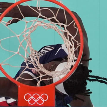 Jul 28, 2024; Villeneuve-d'Ascq, France; United States guard Jrue Holiday (12) shoots in the fourth quarter against Serbia during the Paris 2024 Olympic Summer Games at Stade Pierre-Mauroy. Mandatory Credit: John David Mercer-USA TODAY Sports