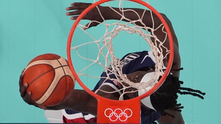 Jul 28, 2024; Villeneuve-d'Ascq, France; United States guard Jrue Holiday (12) shoots in the fourth quarter against Serbia during the Paris 2024 Olympic Summer Games at Stade Pierre-Mauroy. Mandatory Credit: John David Mercer-USA TODAY Sports