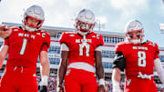 Oct 4, 2025; Raleigh, North Carolina, USA; NC State Wolfpack quarterback CJ Bailey (11), linebacker Caden Fordham (1), wide receiver Keenan Jackson (8) during the coin toss prior to the first half of the game against Campbell Fighting Camels at Carter-Finley Stadium. Mandatory Credit: Jaylynn Nash-Imagn Images