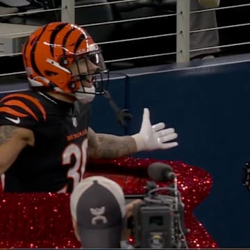 Brown celebrates in the Salvation Army kettle.
