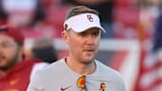 Oct 15, 2022; Salt Lake City, Utah, USA; USC Trojans head coach Lincoln Riley watches warm ups prior to a game against the Utah Utes at Rice-Eccles Stadium. Mandatory Credit: Rob Gray-Imagn Images