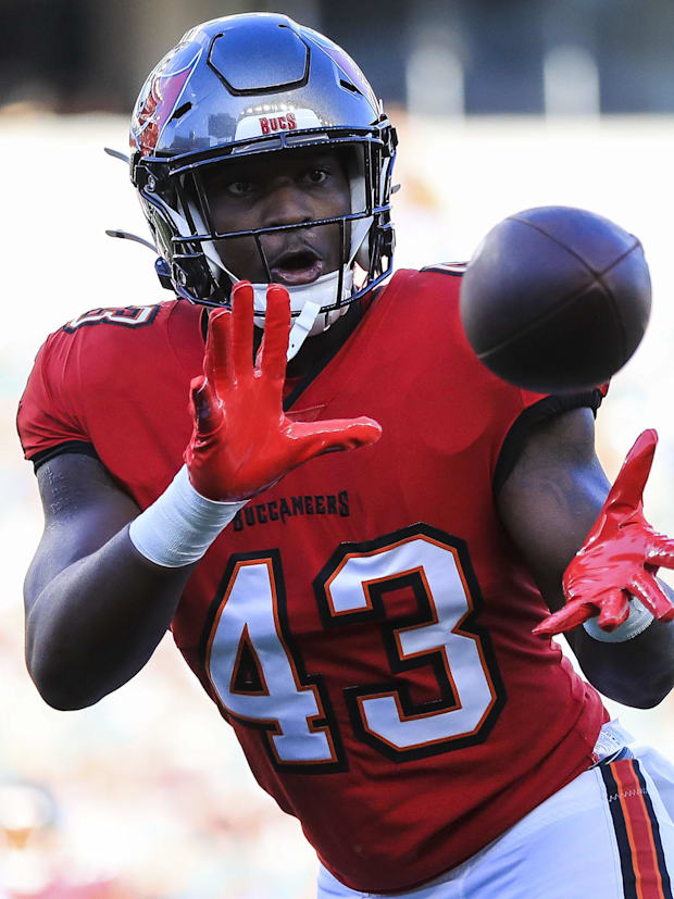 ampa Bay Buccaneers linebacker Chris Braswell (43) catches a pass during warmups  