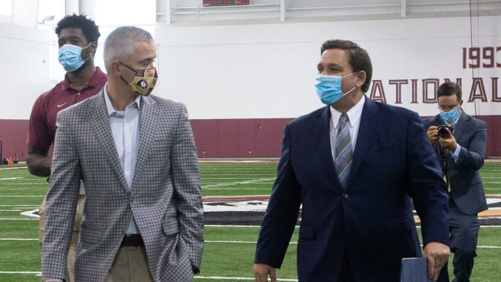 Gov. Ron DeSantis and Florida State University Head Football Coach Mike Norvell chat as they head out after a collegiate athletics roundtable held by DeSantis at the Albert J. Dunlap Athletic Training Facility on the FSU campus Tuesday, August 11, 2020.