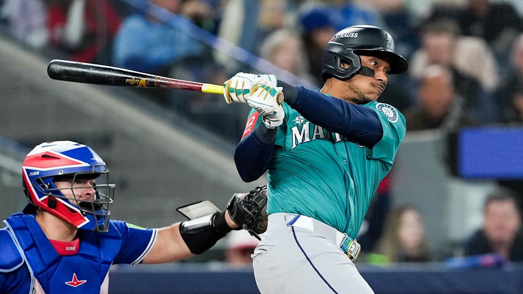 Oct 13, 2025; Toronto, Ontario, CAN; Seattle Mariners infielder Jorge Polanco (7) singles in the seventh inning against the Toronto Blue Jays during game two of the ALCS round for the 2025 MLB playoffs at Rogers Centre. Mandatory Credit: Nick Turchiaro-Imagn Images