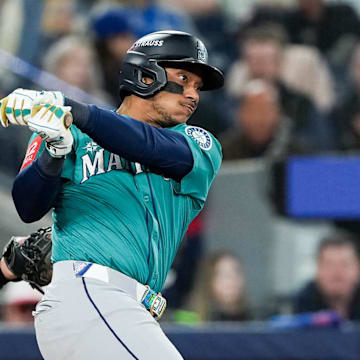 Oct 13, 2025; Toronto, Ontario, CAN; Seattle Mariners infielder Jorge Polanco (7) singles in the seventh inning against the Toronto Blue Jays during game two of the ALCS round for the 2025 MLB playoffs at Rogers Centre. Mandatory Credit: Nick Turchiaro-Imagn Images