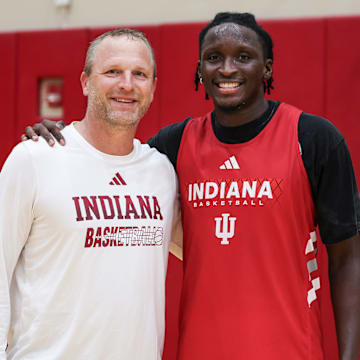 Indiana men's basketball coach Darian DeVries poses with Victor Oladipo at practice July 31 inside Cook Hall in Bloomington.