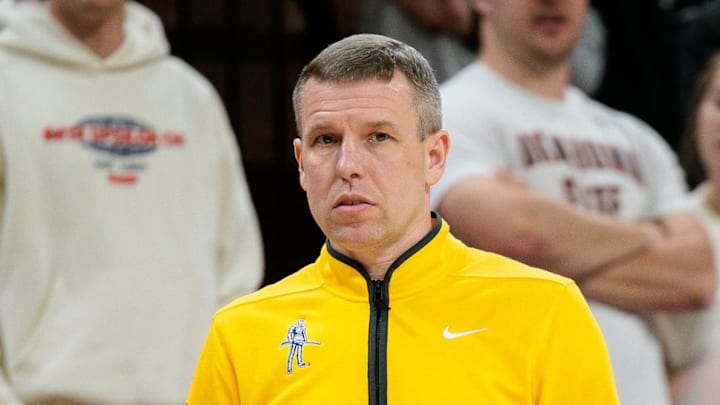 Feb 24, 2026; Stillwater, Oklahoma, USA; West Virginia Mountaineers coach Ross Hodge watches game play during the first half against the Oklahoma State Cowboys at Gallagher-Iba Arena. Mandatory Credit: William Purnell-Imagn Images