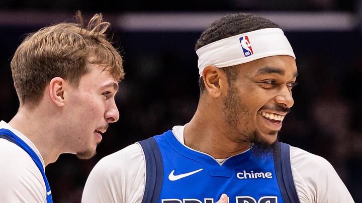 Mar 16, 2026; New Orleans, Louisiana, USA;  Dallas Mavericks forward Cooper Flagg (32) shares a moment with forward P.J. Washington (25) against the New Orleans Pelicans during the first half at Smoothie King Center. Mandatory Credit: Stephen Lew-Imagn Images