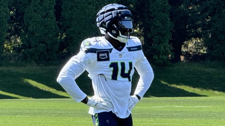 Seattle Seahawks receiver DK Metcalf watches from the sideline during a training camp practice at the VMAC.