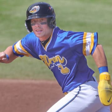 RubberDucks baserunner Travis Bazzana takes off for third base against the Altoona Curve on April 13, 2025, in Akron, Ohio.