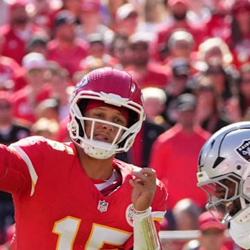 Oct 19, 2025; Kansas City, Missouri, USA; Kansas City Chiefs quarterback Patrick Mahomes (15) passes the ball against the Las Vegas Raiders during the second quarter of the game at GEHA Field at Arrowhead Stadium. Mandatory Credit: Denny Medley-Imagn Images