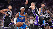 Mar 25, 2025; Sacramento, California, USA; Oklahoma City Thunder guard Shai Gilgeous-Alexander (2) drives to the hoop next to Sacramento Kings guard Zach LaVine (8) in the third quarter at the Golden 1 Center. Mandatory Credit: Cary Edmondson-Imagn Images