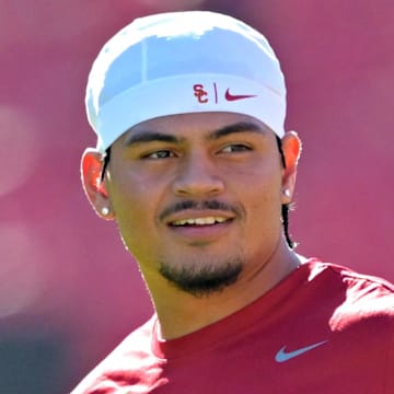 Oct 11, 2025; Los Angeles, California, USA;  USC Trojans quarterback Jayden Maiava (14) warms up prior to the game against the Michigan Wolverines at United Airlines Field at the Los Angeles Memorial Coliseum. Mandatory Credit: Jayne Kamin-Oncea-Imagn Images