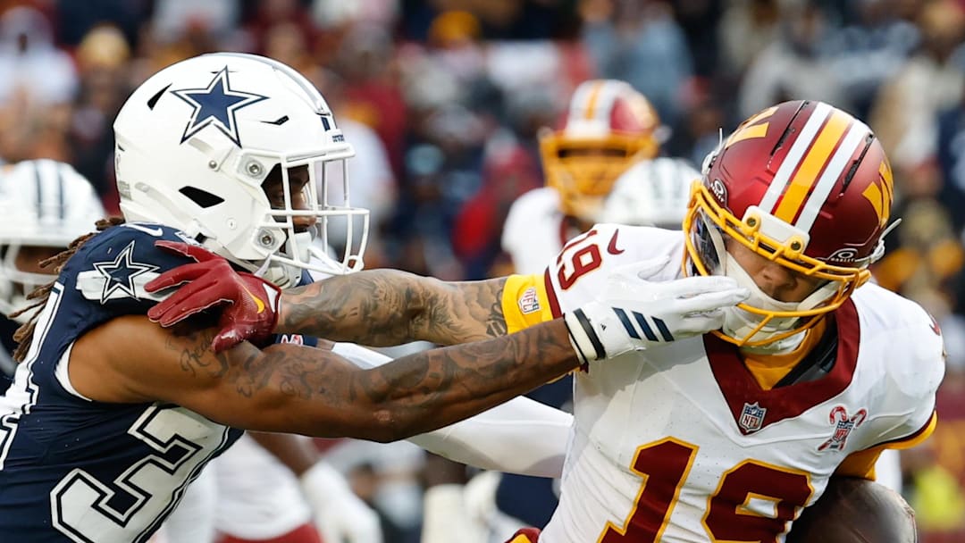 Washington Commanders wide receiver Chris Moore defended by Dallas Cowboys cornerback Shavon Revel Jr.