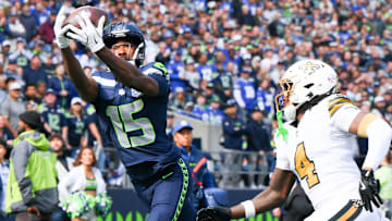 Sep 21, 2025; Seattle, Washington, USA; Seattle Seahawks wide receiver Tory Horton (15) catches the ball for a touchdown during the second quarter against the New Orleans Saints at Lumen Field.