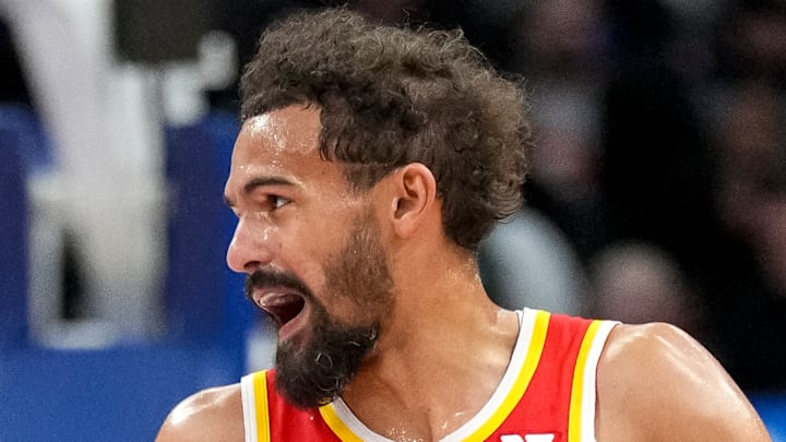 Trae Young #11 of the Atlanta Hawks dribbles against the Detroit Pistons.