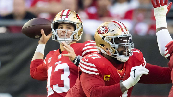 San Francisco 49ers offensive lineman Trent Williams blocks for quarterback Brock Purdy. San Francisco 49ers offensive lineman Trent Williams blocks for quarterback Brock Purdy.