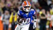 Oct 5, 2024; Gainesville, Florida, USA; Florida Gators wide receiver Tank Hawkins (10) runs with the ball against the UCF Knights during the first half at Ben Hill Griffin Stadium. Mandatory Credit: Matt Pendleton-Imagn Images