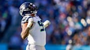 Seattle Seahawks defensive end Leonard Williams (99) celebrates sacking Tennessee Titans quarterback Cam Ward (1) during the third quarter at Nissan Stadium in Nashville, Tenn., Sunday, Nov. 23, 2025.