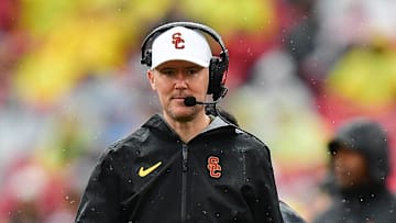 Nov 15, 2025; Los Angeles, California, USA; Southern California Trojans head coach Lincoln Riley watches game action against the Iowa Hawkeyes during the first half at the Los Angeles Memorial Coliseum. Mandatory Credit: Gary A. Vasquez-Imagn Images