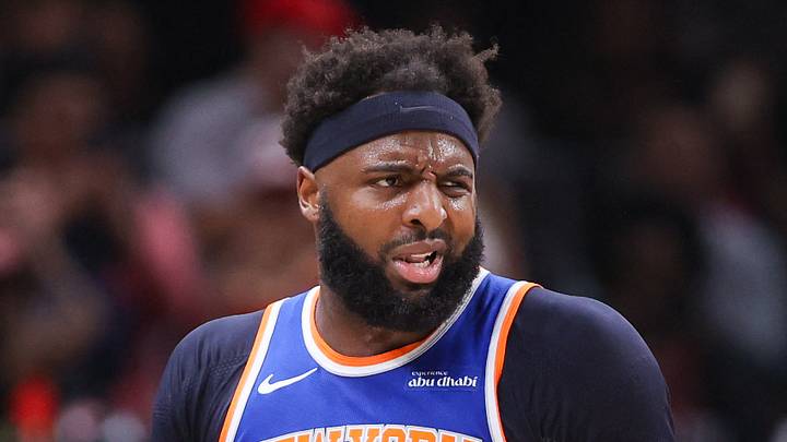 Apr 30, 2026; Atlanta, Georgia, USA; New York Knicks center Mitchell Robinson (23) is restrained by assistant coach Rick Brunson against the Atlanta Hawks in the second quarter during game six of the first round of the 2026 NBA Playoffs at State Farm Arena. Mandatory Credit: Brett Davis-Imagn Images
