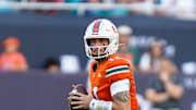Nov 8, 2025; Miami Gardens, Florida, USA; Miami Hurricanes quarterback Carson Beck (11) looks to pass against the Syracuse Orange during the first quarter at Hard Rock Stadium. Mandatory Credit: Jeff Romance-Imagn Images