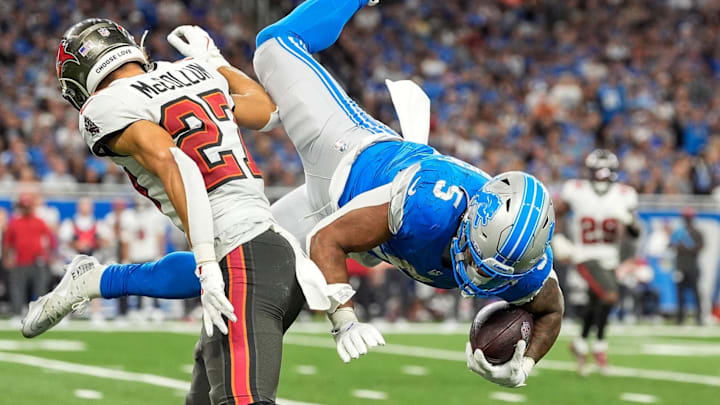 Detroit Lions running back David Montgomery (5) jumps over Tampa Bay Buccaneers cornerback Zyon McCollum (27) Detroit Lions running back David Montgomery (5) jumps over Tampa Bay Buccaneers cornerback Zyon McCollum (27)