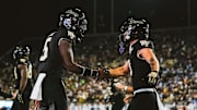 Nov 15, 2025; Winston-Salem, North Carolina, USA; Wake Forest Demon Deacons quarterback Deshawn Purdie (5) and wide receiver Carlos Hernandez (8) celebrate after a play against the North Carolina Tar Heels at Allegacy Federal Credit Union Stadium. Mandatory Credit: Wake Forest Athletics via Imagn Images