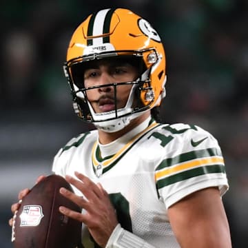 Green Bay Packers quarterback Jordan Love (10) drops back to pass against the Philadelphia Eagles during their playoff game.