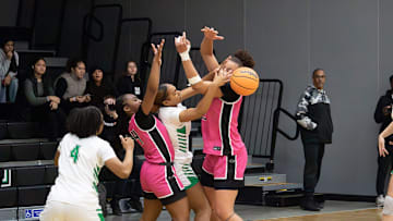 St. Mary's Kylie Limbrick (middle) misplaces the ball with Cydnee Bryant (right) during the MLK Showcase Tournament at St. Marys High School in Stockton, CA. on Jan. 13, 2024.