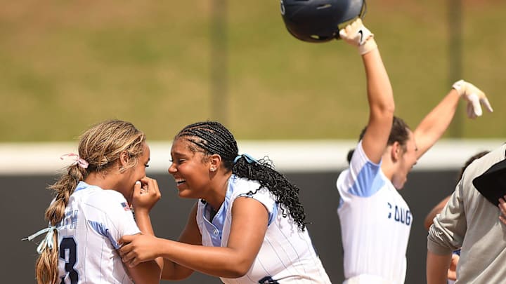 South Brunswick's #13 Kina Davis and #23 Tyianna Cummings celebrate after they beat Kings Mountain 2-1 in the 3A softball state championship game at Duke's Jack Katz Stadium Durham, North Carolina. The softball team claimed its first state championship in program history by sweeping Kings Mountain on June 1, 2024. KEN BLEVINS/STARNEWS South Brunswick's #13 Kina Davis and #23 Tyianna Cummings celebrate after they beat Kings Mountain 2-1 in the 3A softball state championship game at Duke's Jack Katz Stadium Durham, North Carolina. The softball team claimed its first state championship in program history by sweeping Kings Mountain on June 1, 2024. KEN BLEVINS/STARNEWS