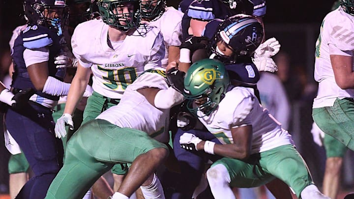 Hoggard's Tamear Webb fights for yards as Hoggard took on Cardinal Gibbons in a 4A semifinal Friday, Dec. 1, 2023, at Hoggard's Scott Braswell Stadium in Wilmington, N.C. Hoggard's Tamear Webb fights for yards as Hoggard took on Cardinal Gibbons in a 4A semifinal Friday, Dec. 1, 2023, at Hoggard's Scott Braswell Stadium in Wilmington, N.C.